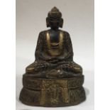 A CHINESE BRONZE BUDDHA Seated pose, with cast figures within shires to base. (approx 17cm)