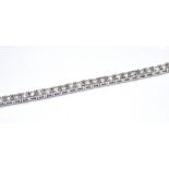 AN 18K WHITE GOLD BRACELET SET WITH 2.62CT OF ROUND CUT DIAMONDS. (17.5cm) weight approx 7gm.
