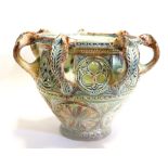 A 19TH CENTURY CONTINENTAL ART POTTERY VASE Having eight handles and pierced decoration, incised
