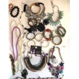 A COLLECTION OF VINTAGE COSTUME JEWELLERY Including paste set necklaces and diamanté bracelets, in