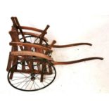AN EARLY 20TH CENTURY BEECHWOOD TRAP/DOG CART On two iron spoked wheels. (128cm x 52cm)