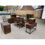 A 20TH CENTURY JACOBEAN DESIGN OAK SUIT OF FURNITURE Comprising of drawer leaf table, six dining