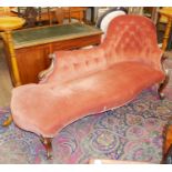 A VICTORIAN MAHOGANY CHAISE LOUNGE Button back salmon pink upholstery on serpentine rail, raised