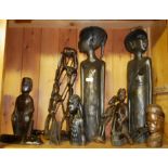 A COLLECTION OF AFRICAN TRIBAL ART WOOD CARVINGS including two female figures carved in profile