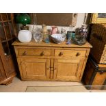 A 19TH CENTURY WAXED PINE SIDE CABINET With an arrangement of two drawers above two cupboard