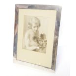 A LARGE EARLY 20TH CENTURY SILVER RECTANGULAR PHOTOGRAPH FRAME Plain design, hallmarked Goldsmith