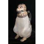 A SILVER PLATED AND VASELINE GLASS CLARET JUG, IN THE FORM OF A MONKEY With red glass eyes. (20cm)