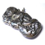 A WHITE METAL DRAGON FORM RECTANGULAR VESTA CASE With entwined Chinese dragon design. (approx 5.
