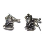 A PAIR OF SILVER 'MICHELIN MAN' GENTS CUFFLINKS In standing pose. (approx 2.5cm)