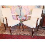 A PAIR OF GEORGE I DESIGN MAHOGANY FRAMED OPEN ARMCHAIRS In cream fabric upholstery, on cabriole