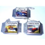 A SET OF THREE SILVER PLATE AND ENAMEL WINE LABELS Featuring vintage racing cars, marked '