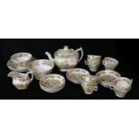 AN EARLY 19TH CENTURY ENGLISH POTTERY TEA SERVICE Decorated in a Chinese tea drinking ceremony