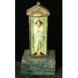 A NOVELTY COLD PAINTED DESK BRONZE, IN THE FORM OF A GEMALE BATHER On green marble base. (15cm)