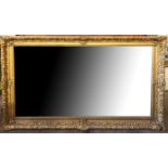 A 19TH CENTURY GILT FRAME MIRROR Carved with floral decoration, with later silvered plate.