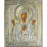 A LATE 19TH CENTURY RUSSIAN ICON, VIRGIN MARY AND CHILD, OIL ON PANEL Encases with silver gilt