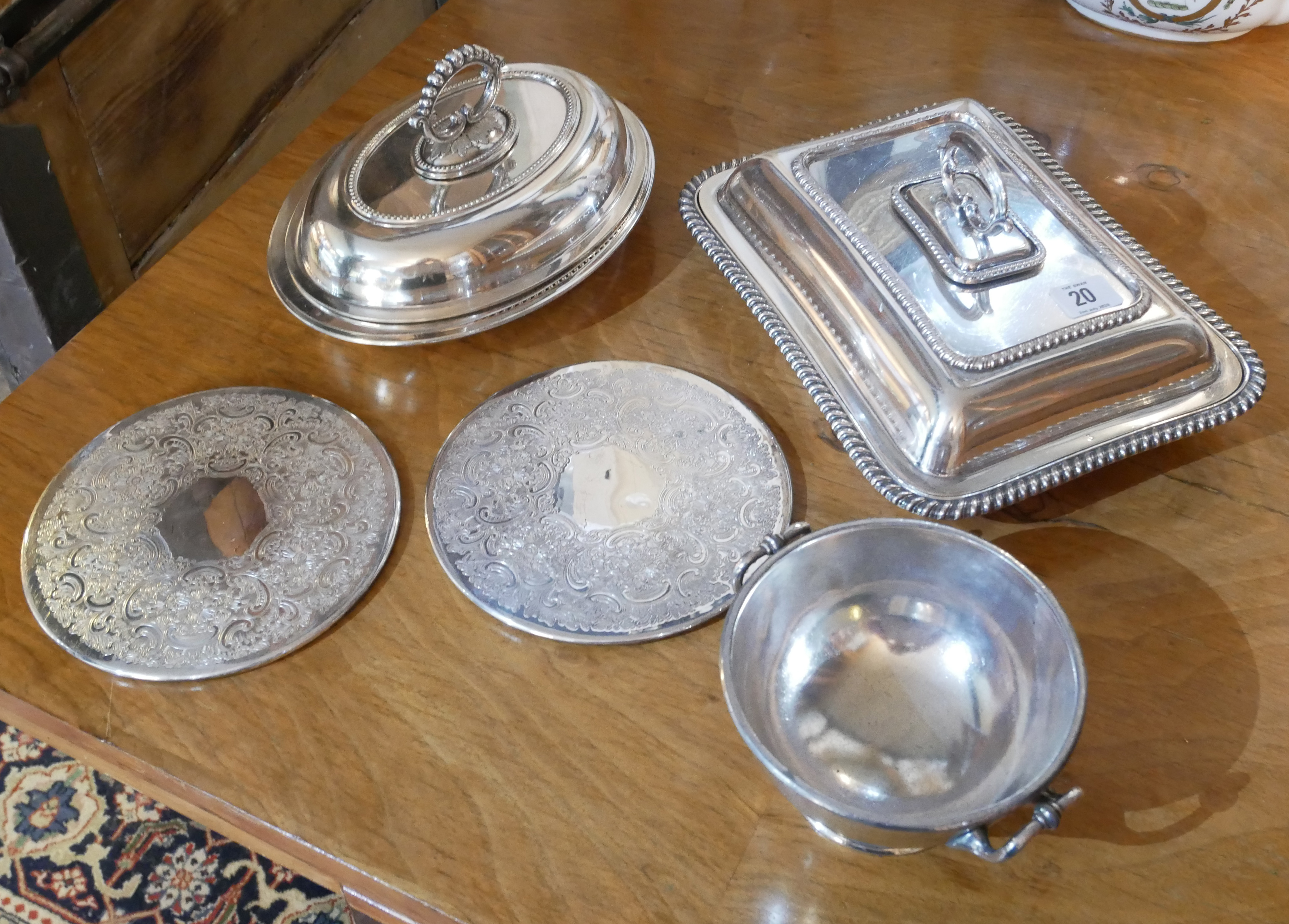 A COLLECTION OF VARIOUS SILVER PLATED To include two tureens, place mats and bowl.