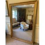 A LARGE 19TH CENTURY FRENCH GILTWOOD AND GESSO MIRROR Decorated with flowers with original mercury