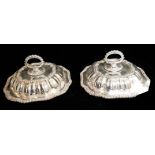 A PAIR OF EARLY 20TH CENTURY SILVER PLATED OCTAGONAL ENTRÉE DISHES Having a loop handle key and