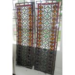 A PAIR OF VICTORIAN STAINED GLASS PANELS. (35cm x 107cm)