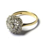 A 9CT GOLD AND DIAMOND CLUSTER RING The arrangement of round cut diamonds forming a daisy design (