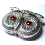 A SILVER PLATED OWL MASK FIRM VESTA CASE Hinged lid with glass set eyes and strike base. (approx 5cm