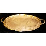 AN EARLY 20TH CENTURY SILVER PLATED OVAL SERVING TRAY With twin handles with pie crust edge,
