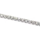 AN IMPRESSIVE 18K WHITE GOLD TENNIS BRACELET Set with 16.28ct of round cut diamonds. (18cm) weight