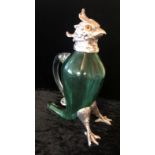 A SILVER PLATED AND GREEN GLASS CLARET JUG In the form of a parrot with glass eyes. (27cm)