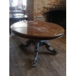 A VICTORIAN MAHOGANY EXTENDING BREAKFAST TABLE With one extra leaf, the circular top raised on a