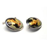 A PAIR OF SILVER AND ENAMEL EROTIC OVAL CUFFLINKS Ename panel featuring an Art Deco design female