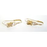 A VINTAGE PAIR OF 14CT GOLD AND PASTE SET EARRINGS Pear cut stones in a butterfly design. (approx