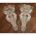 A PAIR OF 19TH CENTURY PLASTER CORNER WALL BRACKETS Classical form, figured with putti. (47cm)