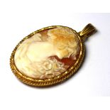 A VINTAGE YELLOW METAL OVAL SHELL CAMEO PENDANT Matt finish, in yellow metal frame. (approx 3cm x