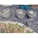 THREE WEATHERED RECONSTITUTED STONE GARDEN POTS H30 X D32cm