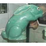 A FRENCH ART DECO GREEN GLAZED STATUE OF A RABBIT. (20cm)