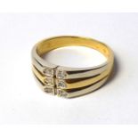 AN 18CT BI-COLOUR GOLD AND DIAMOND RING Having three rows of diamonds on yellow gold shank (size M).