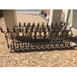 A SET OF THREE VICTORIAN CAST WROUGHT IRON RAILINGS Cast with fleur-de-lis and Gothic arches. (