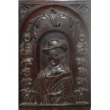 AN ANTIQUE CARVED OAK PANEL, PORTRAIT OF A 16 TH/17TH CENTURY GENTLEMAN Floral border. (34cm x 53cm)