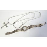 A VINTAGE SILVER AND AQUAMARINE CRUCIFIX PENDANT NECKLACE The central Princess cut stone flanked