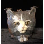 CESCHUTZT, A COLD PAINTED BRONZE ASHTRAY Cast with cat masks. (10cm)