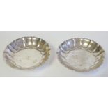 A PAIR OF EARLY 20TH CENTURY SILVER SWEETMEAT DISHES Having a fluted edge, hallmarked Searle and