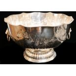 A 20TH CENTURY SILVER PLATE ON COPPER PUNCH BOWL Having twin lion mask handles, embossed classical