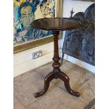 A VICTORIAN MAHOGANY WINE TABLE The circular dish top, raised on a turned column with three