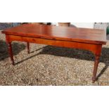 AN EARLY 20TH CENTURY FRENCH SOID CHERRYWOOD FOUR PLANK TOP DRAW LEAF TABLE With a single drawer and
