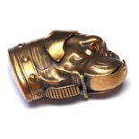 A BRASS PUG DOG HEAD FORM VESTA CASE Set with glass eyes, hinged mouth and striker. (approx 4cm x