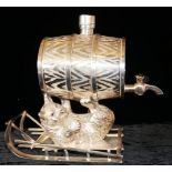 A SILVER PLATED FIGURAL OVAL BRANDY BARREL With engraved decoration of a cast Russian bear and