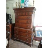 AN 18TH CENTURY OAK CHEST ON CHEST The mahogany and herring bone cornice above three short and six