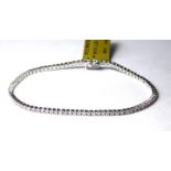 AN 18CT WHITE GOLD AND DIAMOND TENNIS BRACELET A single line of round cut diamonds Approx 1.68ct