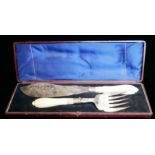 A CASED PAIR OF VICTORIAN SILVER PLATE AND IVORY FISH SERVERS Aesthetic form with engraved floral