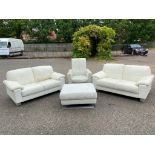 A PAIR OF CONTEMPORARY CREAM LEATHER UPHOLSTERED TWO SEAT SETTEES Along with an armchair and